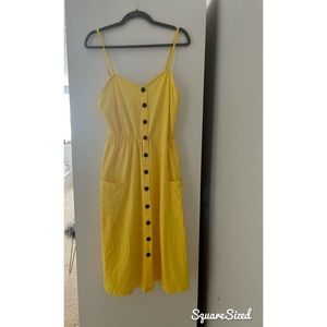 Yellow knee length summer dress with pockets